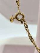 24" 18k chain with extra link , Extra link can be used as ring with size of 5.5 inch