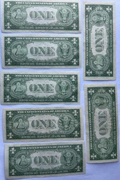 Seven 1935 E Unc $1 Silver Certificates.
