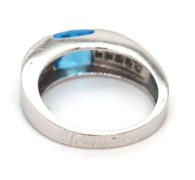 14kt White gold 0.80ct blue topaz and 0.50ctw diamond ring