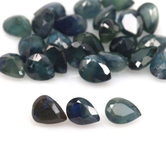 Heated only! 10.94ct blue green Sapphire set