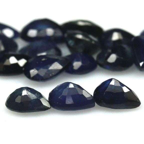 Beautifully colored 6.58ct ink blue Sapphire set