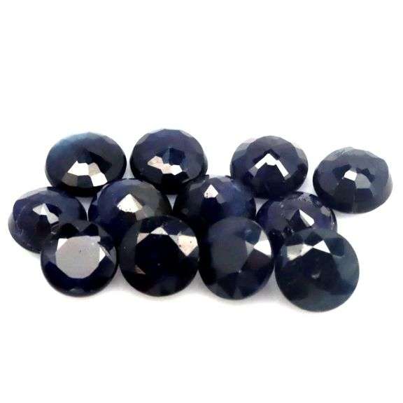 Beautifully colored 8.85ct midnight blue Sapphire set