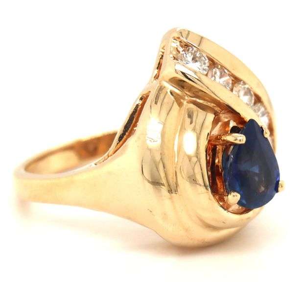 14kt Yellow gold 1.10ct sapphire and 0.50ctw diamond swirl ring