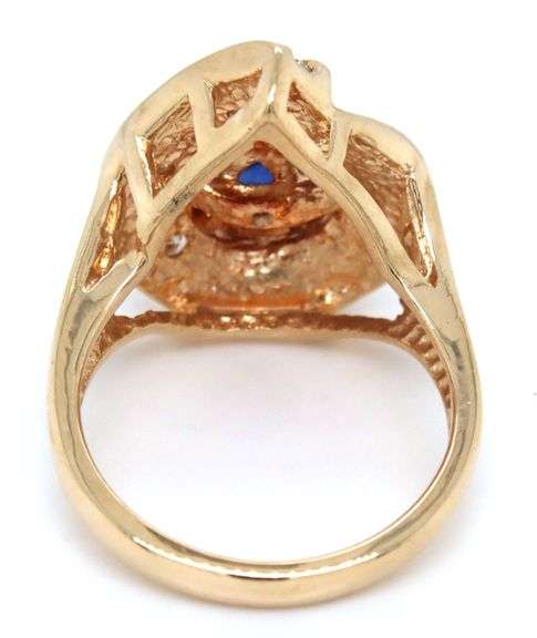 14kt Yellow gold 1.10ct sapphire and 0.50ctw diamond swirl ring