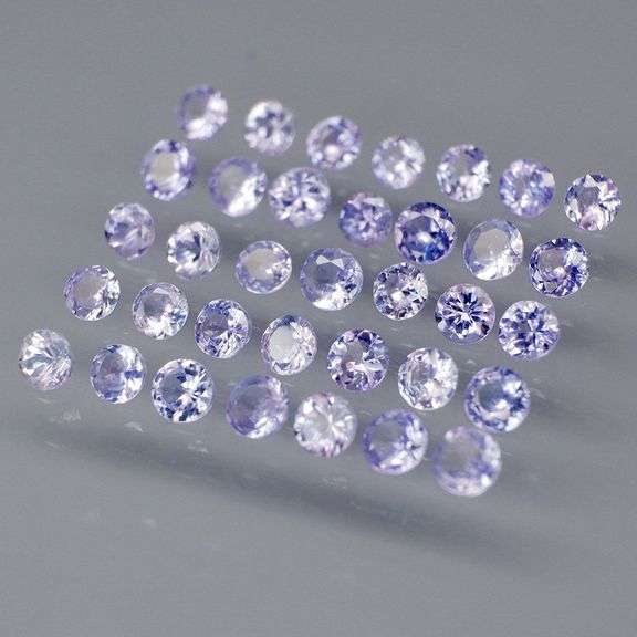 Heavy flashing 3.46ct round cut Tanzanite set