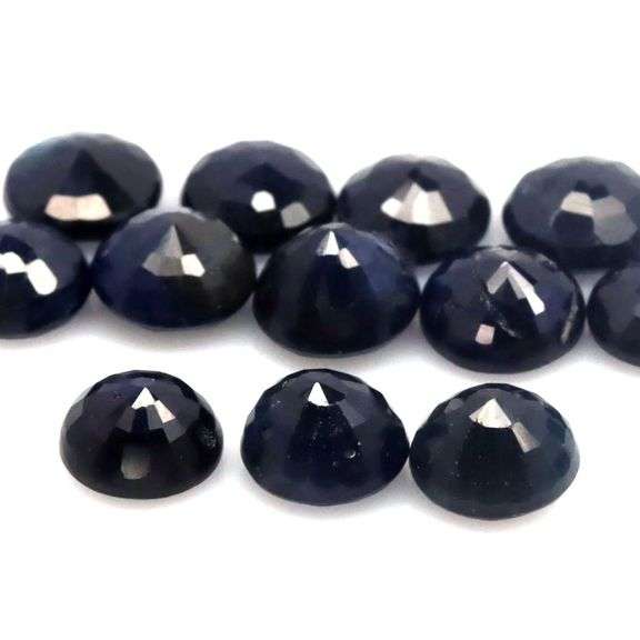 Beautifully colored 8.85ct midnight blue Sapphire set