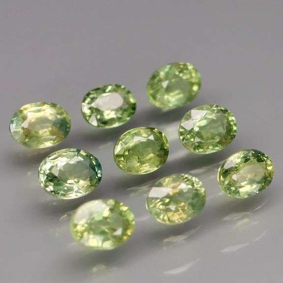 Untreated! Fantastic 2.50ct bright green Sapphire set!
