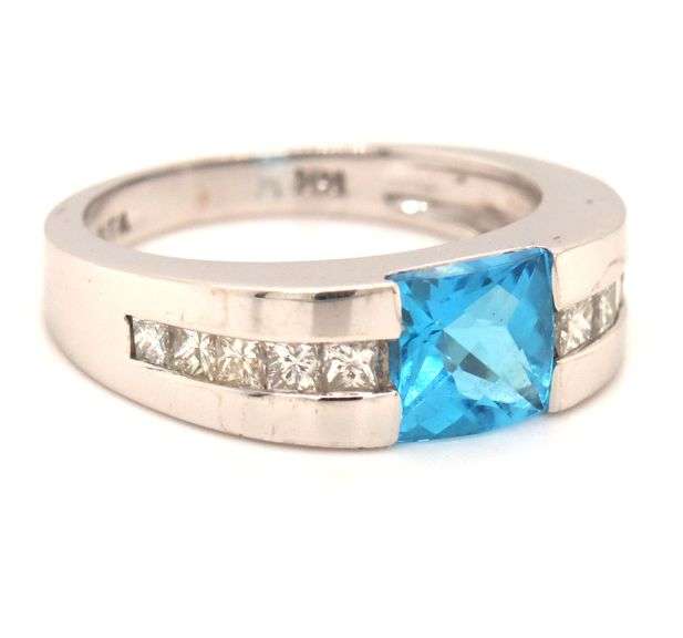 14kt White gold 0.80ct blue topaz and 0.50ctw diamond ring