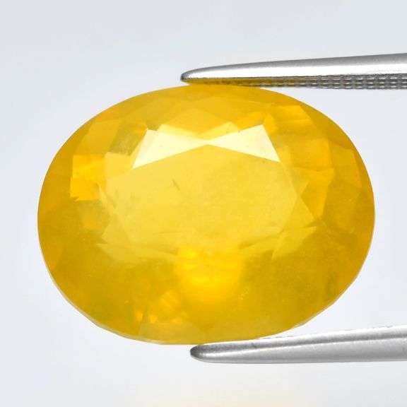 Huge! 7.81ct untreated faceted golden Opal!