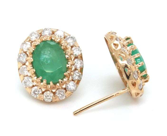 14kt Yellow gold oval emerald and diamond halo earrings