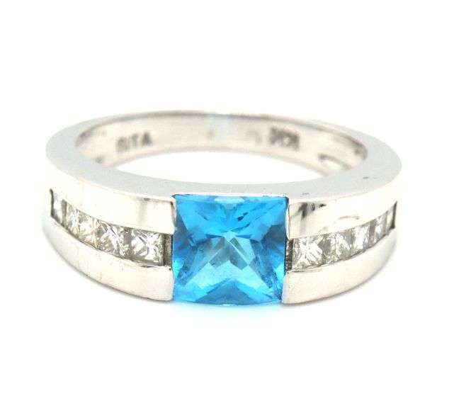14kt White gold 0.80ct blue topaz and 0.50ctw diamond ring