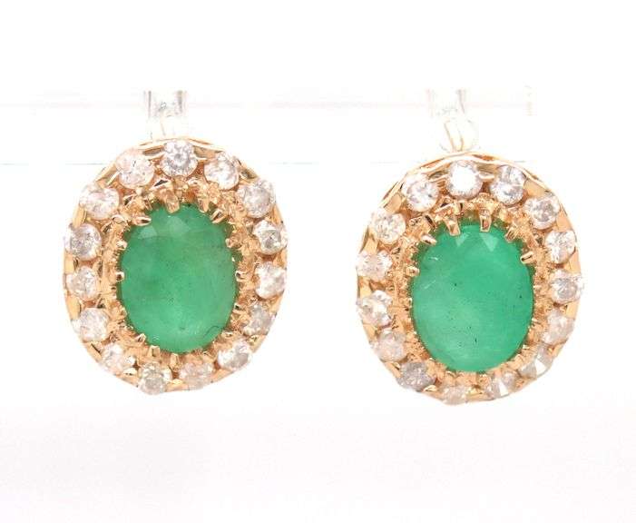 14kt Yellow gold oval emerald and diamond halo earrings