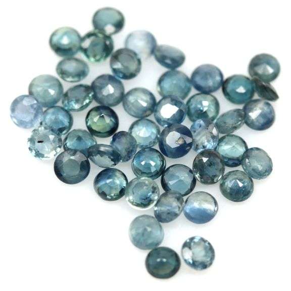 Heated only! 6.62ct blue green Sapphire set