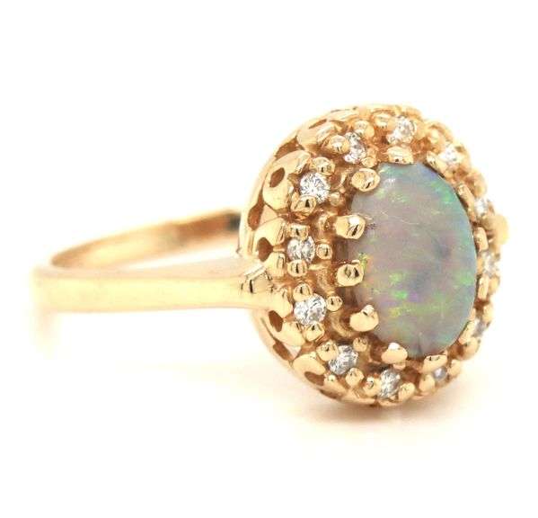 14kt Yellow gold Oval opal and diamond halo ring