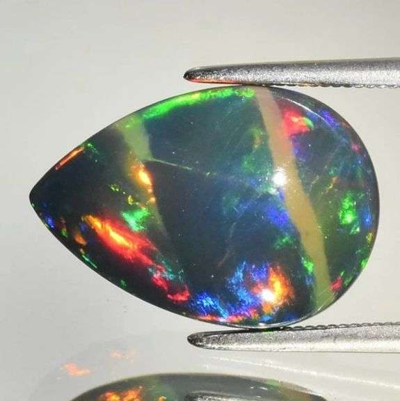 Intense full body play of color! 6.90ct Ethiopian Black Opal!!!