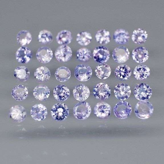 Heavy flashing 3.46ct round cut Tanzanite set