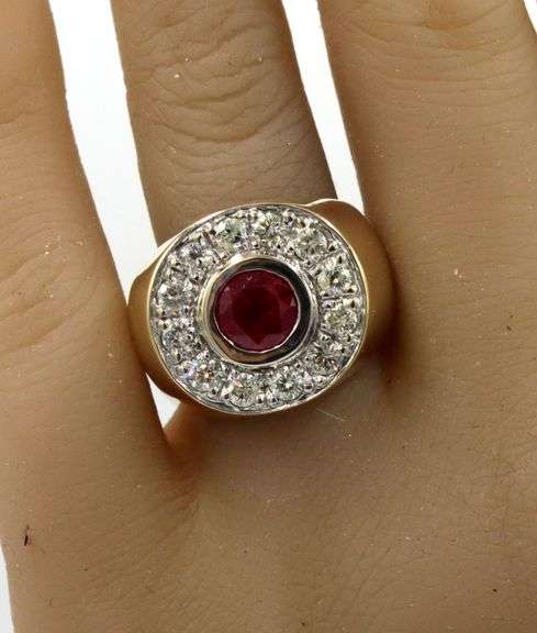 14kt Yellow gold 1.50ct ruby and 0.75ctw diamond halo ring