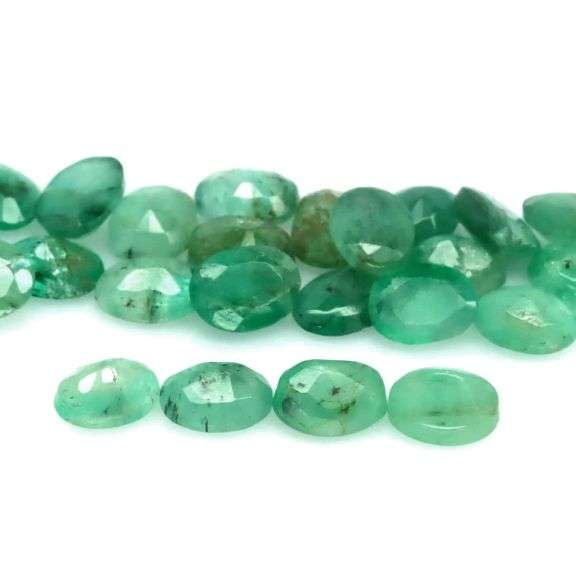 Oval cut 7.82ct 27pc Zambain Emerald set