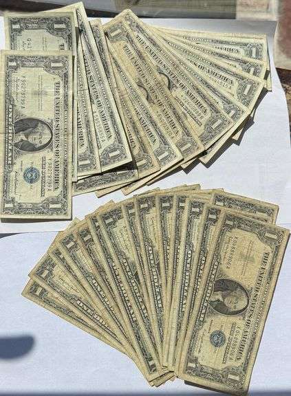 Thirty Two Assorted 1957 Series  $ 1 Silver Certificates