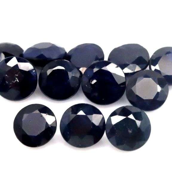 Beautifully colored 8.85ct midnight blue Sapphire set