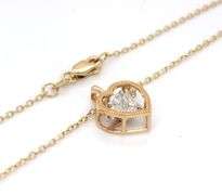 14kt Yellow gold 0.65ctw marquise and princess cut dancing diamond heart shaped pendant on chain