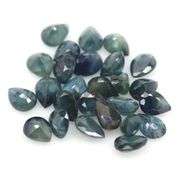 Heated only! 10.94ct blue green Sapphire set