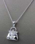14kt White gold diamond accent purse pendant on chain