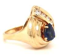 14kt Yellow gold 1.10ct sapphire and 0.50ctw diamond swirl ring