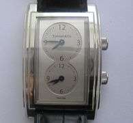 TIFFANY & CO. MEN'S DUAL TIME ZONE WATCH.