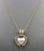 18kt Yellow gold heart shaped Mabe pearl and pear ruby and diamond accent enhancer pendant on chain