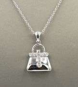 14kt White gold diamond accent purse pendant on chain