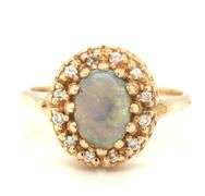 14kt Yellow gold Oval opal and diamond halo ring
