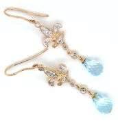 14kt Yellow gold blue topaz and diamond Fluer De Lis dangle earrings