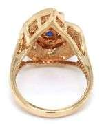 14kt Yellow gold 1.10ct sapphire and 0.50ctw diamond swirl ring