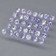 Heavy flashing 3.46ct round cut Tanzanite set
