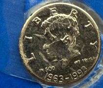 Two Solid 14 K Gold JFK Memorial Half Dollars.