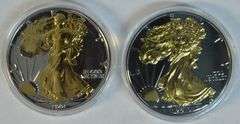 1991 & 2019 2-sided Golden enameled $1 Silver Eagles in capsules