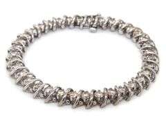 14kt White gold approximate 5.40ctw diamond S link tennis bracelet