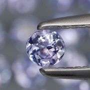 Heavy flashing 3.46ct round cut Tanzanite set