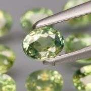 Untreated! Fantastic 2.50ct bright green Sapphire set!