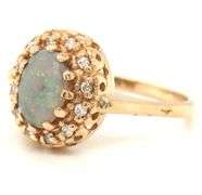 14kt Yellow gold Oval opal and diamond halo ring