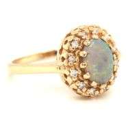 14kt Yellow gold Oval opal and diamond halo ring