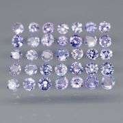 Heavy flashing 3.46ct round cut Tanzanite set