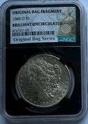 1884 O NGC BU Morgan Dollar.With Original Bag Fragment