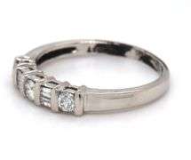 Platinum 0.25ctw round and baguette 5 stone diamond ring