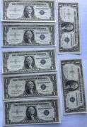 Seven 1935 E Unc $1 Silver Certificates.