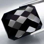 Huge! 28.56ct silky black Loas Tektite