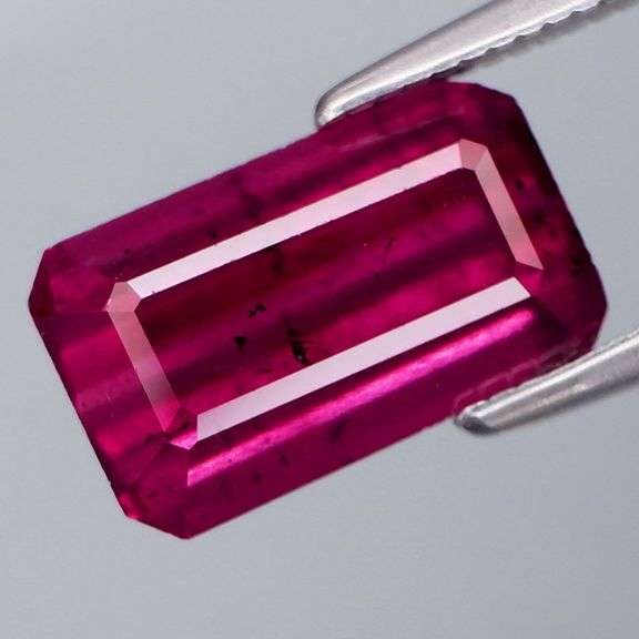 Woah! It's a 4.09ct midnight PINK Rhodolite Garnet!