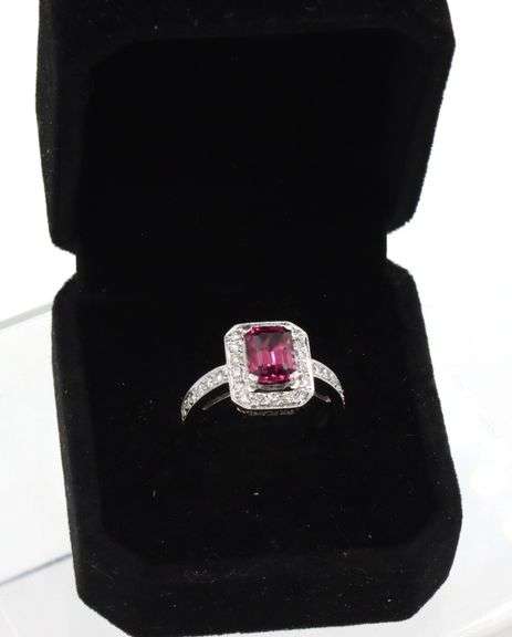 14kt White gold 1.65ct emerald cut tourmaline and diamond halo ring