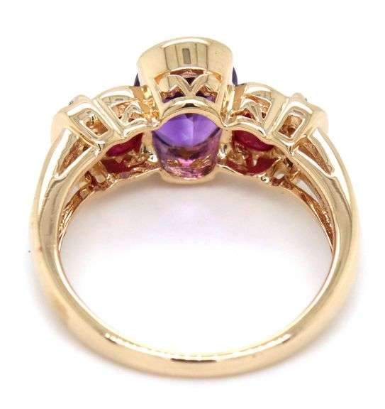 14kt Yellow gold oval amethyst, ruby and diamond accent 3 stone ring